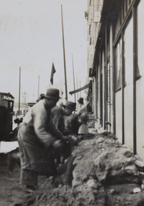 Removing sandbag barricades, Shanghai, 1937