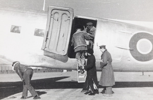 Sir Adrian Carton de Wiart boarding a RAF Dakota, Peking