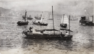Boats in the harbour, some with square sails, Hong Kong