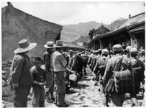 Soldiers marching in a village in West Hebei province