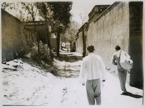Lindsay and two escorts in a Japanese occupied village, after crossing the Peking-Hankow railway line