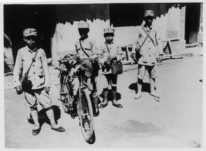 Small boys as army messengers, with a bicycle, Central Hebei province