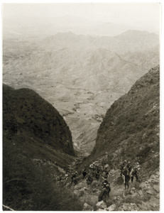 Soldiers ascending a mountain pass, on their way to cross the Chengtai Railway in West Hebei