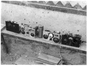 Portable radio sets that Michael Lindsay (林迈可) built for military communications, and a battery cell