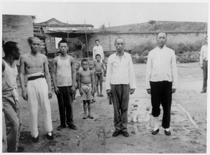 Men and boys pose for a photograph