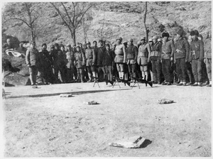 Gathering of militia with bren guns on the ground in front of them, Jinchaji
