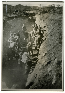 Men digging a wide trench