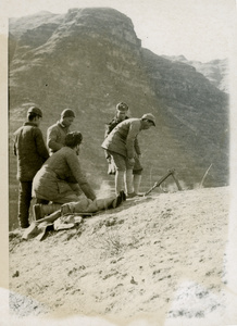 Soldiers and Dr Richard Frey (傅莱) testing a local copy of a small Japanese mortar, Jinchaji, 1943