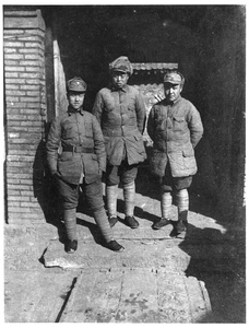 Three Eighth Route Army soldiers by a doorway
