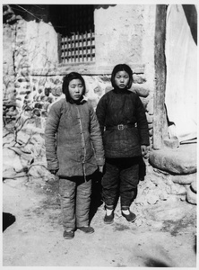 Two women wearing padded winter clothes