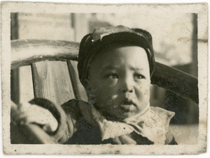 A Chinese baby in a chair