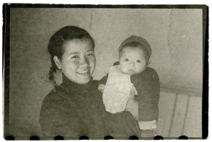 An unidentified woman and a baby