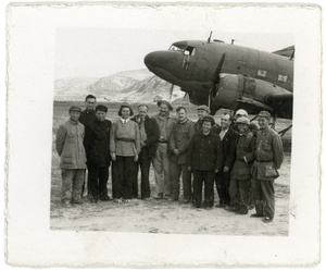A group of Chinese and foreigners next to a Douglas C-47 Skytrain, Yan'an (延安)