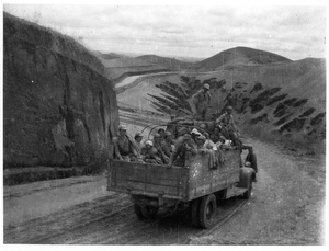 Men, women, and children in the back of a lorry between Suide (綏德) and Yan'an (延安), May 1944