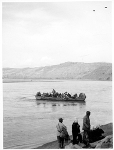 Crossing the Yellow River in a barge, 23 April 1944