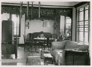 A sitting room and dining room in a mixed Chinese-Western style