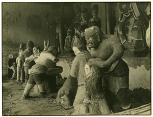 Figures of sinners being punished, by a gateway to ‘Hell’ in a Taoist temple