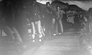 Chinese men on a ship on Tungting Lake