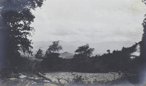 A view towards a river and mountains