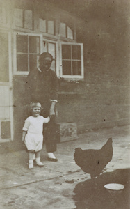 Audrey Gregg, with amah and chicken